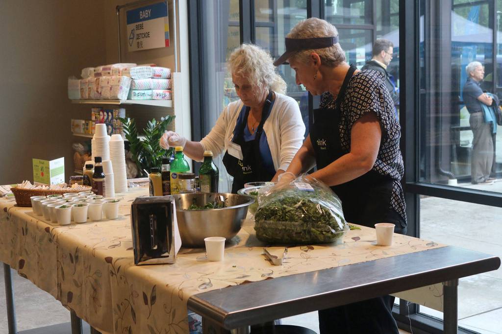 Hopelink volunteers host a cooking demonstration in the Redmond food bank on Aug. 3. Katie Metzger/staff photo