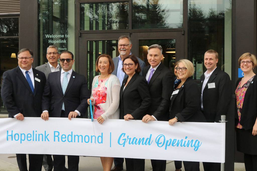 Hopelink CEO Lauren Thomas smiles with project partners and elected officials at the grand opening of the nonprofits new flagship facility in Redmond. Katie Metzger/staff photo
