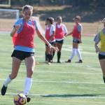 Taylor Pisan, left, and Lily Chirichigno, right, are two of Redmond Highs three captains this season. Allison Nakamura completes the trio. Andy Nystrom / staff photo