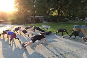 A group of F3 members perform Handslap Merkins as they wait for the other group to return from a run around the parking lot. Photo Courtesy of Brian Dilfer Gawthrop