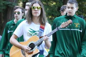 Strumming before running for Redmond Mustang