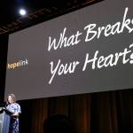Hopelink CEO Lauren Thomas asks the attendees at Hopelinks 23rd annual Reaching Out luncheon to think about what breaks their heart. Katie Metzger/staff photo