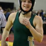 Redmond Highs Molly Williams strolls off the mat following a match at last years state wrestling tournament. Andy Nystrom / staff photo