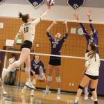 Redmond Highs Maya Holmen (left) attacks the net against North Creek High players during the 4A KingCo tournament on Oct. 25 at North Creek. North Creek won, 3-0. The Mustangs played stellar ball in the thrilling matchup, losing 25-17, 25-23 and 28-26. Redmond lost to Mount Si on Saturday and to Woodinville on Tuesday to end its season. Mustangs Holmen and Piper Ferch are second-team all-leaguers and Caroline Talbot and Mari Torgersen are honorable mentions. Andy Nystrom / staff photo