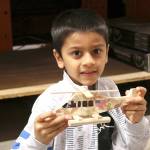 Aadi Panchal, 7 said his favorite part of the workshop was putting stickers on his helicopter. Stephanie Quiroz/staff photo.