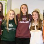 Redmond High athletes sign on to play college ball