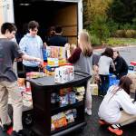Students from The Bear Creek School sort and load food donations in preparation for delivery to Hopelink. Photo courtesy of The Bear Creek School