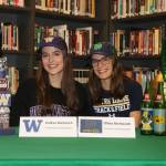 Runners Andrea (left) and Olivia Markezich of The Bear Creek School sign their national letters of intent on Nov. 13. Courtesy photo