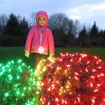 Brooke Pedersen, 6, enjoys the bright lights on the City Hall lawn during Redmond Lights on Dec. 1. Samantha Pak/staff photo