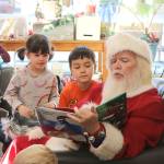 Santa reads to youngsters at story time at Brick and Mortar Books in Redmond Town Center on Dec. 4. Stephanie Quiroz/staff photo.