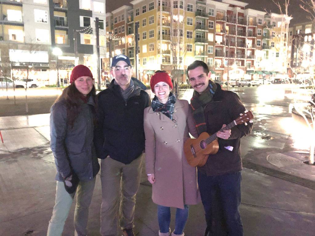 L-R: Meka and Jon Zieger, and Holly and Eric Schoubridge attend the comunity sing-a-long for the second time. Eric Schoubridge brought his ukulele to play along. Stephanie Quiroz/staff photo.
