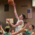 Redmond defeats Woodinville in hoops action