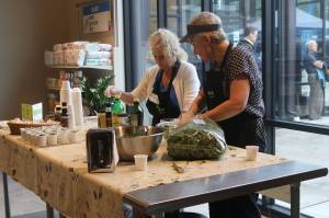 Hopelink volunteers host a cooking demonstration in the Redmond food bank on Aug. 3. The organization recently received a $822,500 grant from Premera. Katie Metzger/staff photo