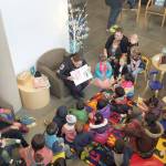 Sergeant Julie Beard reads to the children at the second Little Free Library event on Dec. 27. Courtesy of Andrea Wolf-Buck.