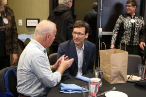 Washington State Attorney General Bob Ferguson visits with Redmond Rotary member Hans Gundersen after the Nov. 15 meeting. Katie Metzger/staff photo