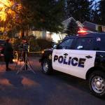 Authorities outside of the Klahanie home on Tuesday. Stephanie Quiroz/staff photo