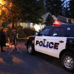 Authorities outside of the Klahanie home on Tuesday. Stephanie Quiroz/staff photo