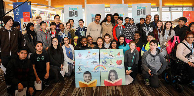 Russell Wilson and Ciara pose with the students from Foster High School at the conclusion of Fridays event. Courtesy photo by Why Not You Foundation