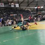 Redmond Mustangs junior wrestler Leah Hiatt, left, pins Teninos Jamiah Christin in just 43 seconds in the girls 115-pound state tournament on Feb. 16 at the Mat Classic at the Tacoma Dome. Hiatt finished in seventh place in the 115-pound weight division. Shaun Scott, staff photo