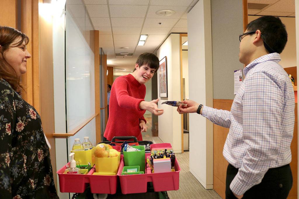 Through the supportive employment organization AtWork! Paige Bisbee, 25, was able to find employment at a law firm in downtown Bellevue. Stephanie Quiroz/staff photo.