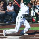 Redmond Highs Darek Khabani connects on a pitch. Andy Nystrom / staff photo