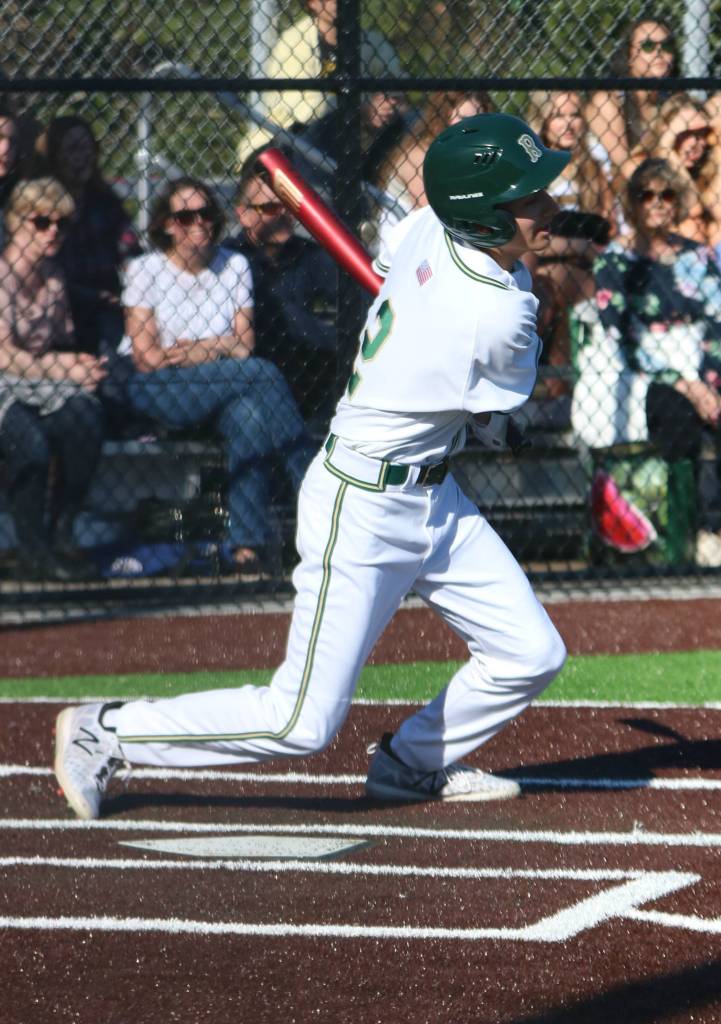 Redmond Highs Darek Khabani connects on a pitch. Andy Nystrom / staff photo