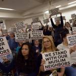During one point of the event, following prayer, attendees held up signs of support. Ashley Hiruko/staff photo