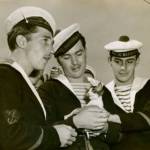 Three French sailors and a kitten, Seattle, 1950. Photo courtesy of Redmond Historical Society
