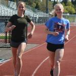 From left, Marie and Anna Petrbokova run on the Redmond High track on Monday afternoon. Andy Nystrom / staff photo
