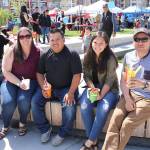 From left: Redmond residents Susana Ramirez, Sergio Ramirez, and Isabel and Jose Basurto eating the traditional Mexican foods at the Cinco de Mayo festival at the Downtown Park on May 5.