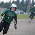 Haley Hanson rounds third to score with Kiki Milloy ripping past second on her way to scoring as well against Newport. Andy Nystrom / staff photo