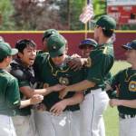 Overlake/Bear Creek baseball players mob Jon Campbell, who hit a grand slam to give the Growls a win at state. Courtesy of the Overlake Twitter page
