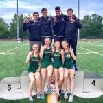 Members of Redmond High Schools 4x400 relay teams pose on the podium after last Fridays 4A district track and field meet held at the Southwest Athletic Complex in West Seattle. Both teams finished first and will compete in the state meet this coming Thursday-Saturday at Mount Tahoma High in Tacoma. Pictured from left are: front, Anna Petrbokova, Sophie Rouse, Liv Wreggelsworth and Marie Petrbokova (4:04.27), and back, George Cretu, Carson Lui, Asres Morris and Eli Jones (3:25.47). In addition to the 4x400 relay teams, individual events entrants and their qualifying finishes at district include: Marie Petrbokova (200 – first, 26.25), Weston Ford (high jump – first, 6-02), Catalina Montanez (300 hurdles – second), Piper Ferch (long jump – second), Lili Hargreaves (1600 and 3200 – third and second), Lui (400 – third) and Dereje Himbago (3200 – third). Naho Masaki, Joanna Gormley and Jacob Raasch are also eligible to compete as alternates on the relay teams. Photo courtesy of Stuart Lui