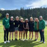 Redmond Highs girls golf team and coaches display their 4A state title trophy. From left to right: Spencer Burnstead, Anna Galipeau, Cynthia Lu, Jordan McCannon, Adithi Anand, Maddie White, Anna Jonson and Tom Bunnell. Courtesy photo
