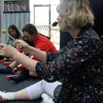 Madison Miller/staff photos                                 Allison Butler leads a class of toddlers and their parents through a Tuesday morning class at Joyous Noise.