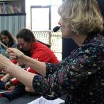 Madison Miller/staff photos                                 Allison Butler leads a class of toddlers and their parents through a Tuesday morning class at Joyous Noise.