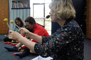 Madison Miller/staff photos                                 Allison Butler leads a class of toddlers and their parents through a Tuesday morning class at Joyous Noise.
