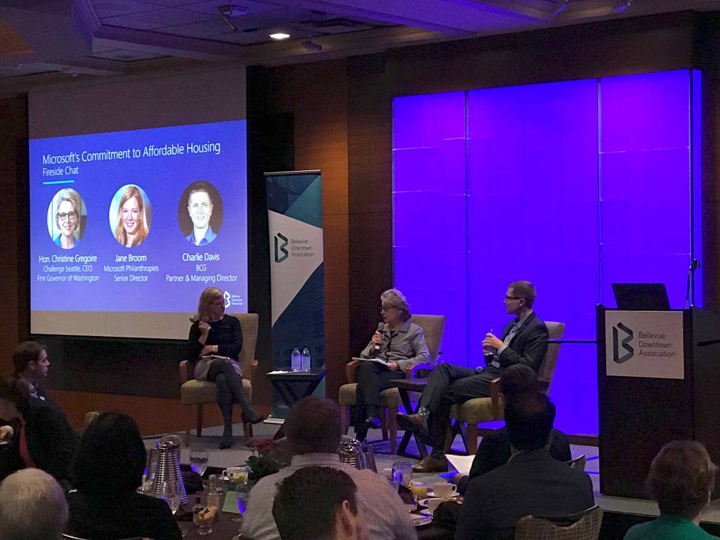 (Left to right) Jane Broom, Microsoft Philanthropies senior director, former Washongton Gov. Christine Gregoire, who now serves as CEO of Challenge Seattle, and Charlie Davis, partner and managing director at the Boston Consulting Group, speak on Microsofts $500 million commitment to affordable housing at a panel discussion during a Bellevue Downtown Association breakfast. Kailan Manandic / staff photo