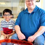 Photo courtesy of the city of Redmond                                 Siddhant Singh, 8, meets Mayor John Marchione to talk about his Beyblade tournament idea.