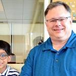Photo courtesy of the city of Redmond                                 Siddhant Singh, 8, meets Mayor John Marchione to talk about his Beyblade tournament idea.