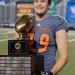 Eastside Catholics Kevin Brown, a Redmond resident, holds the 3A state championship football trophy in November 2018. Photo courtesy of Bodine Sports Photography