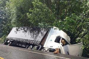 A crash between a semi truck and another vehicle occurred around 4:45 a.m. on July 16 on State Route 202. Photo courtesy of Rick Johnson/Washington State Patrol