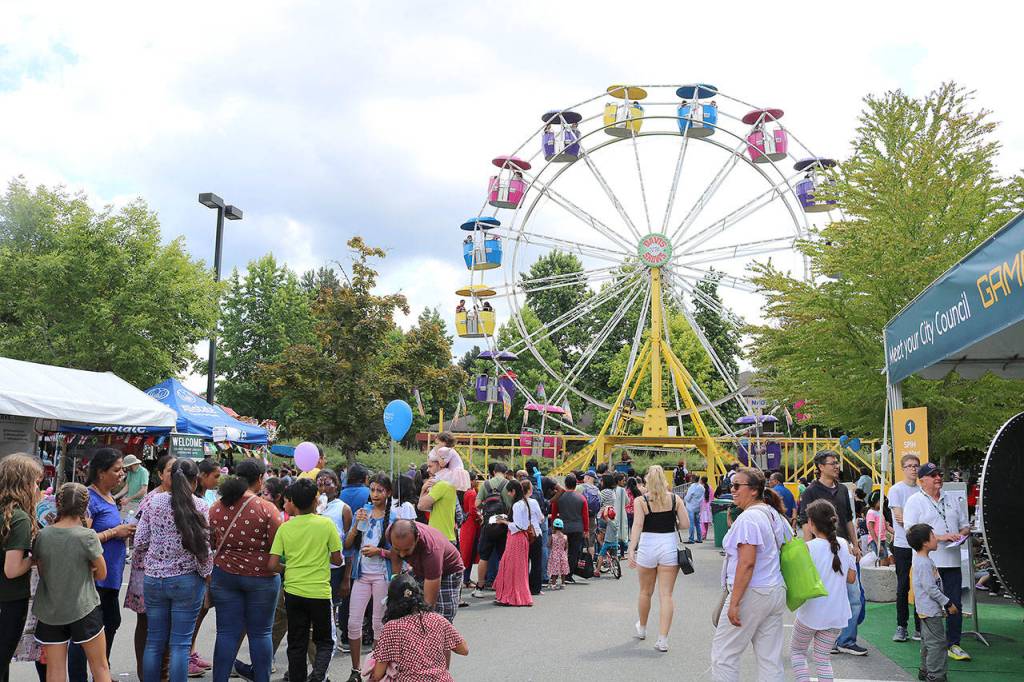 Festival goers enjoy carnival rides and more on July 12. Stephanie Quiroz/staff photo