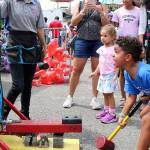 Festival goers at Redmonds Derby Days enjoy carnival games on July 12. Stephanie Quiroz/staff photo