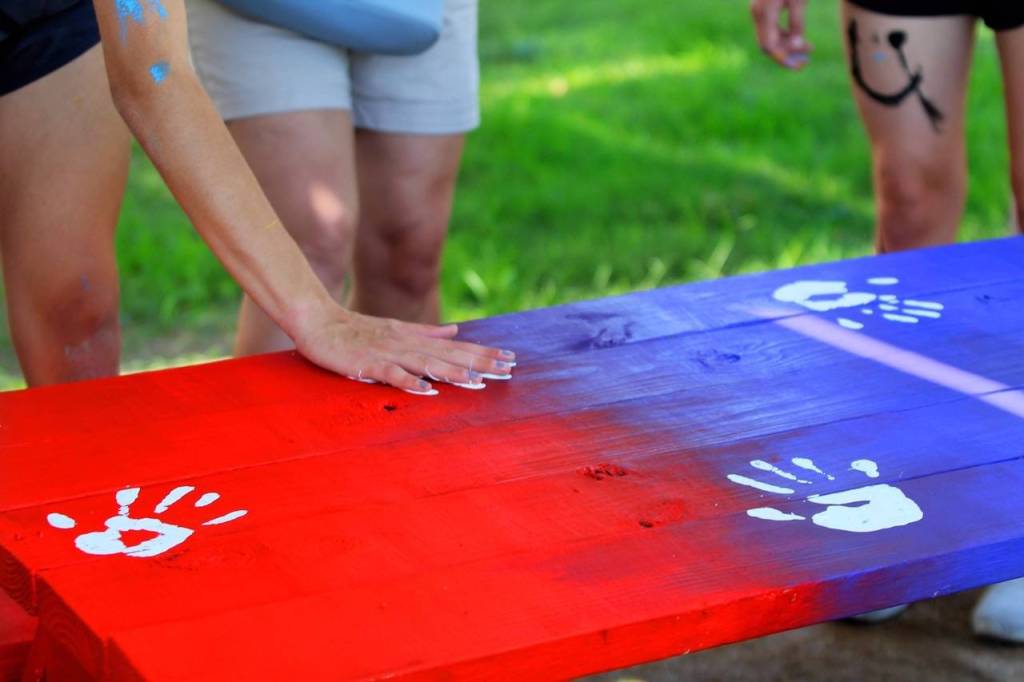 Players leave their handprints on their artwork. Photo courtesy of Cheryl Johnson