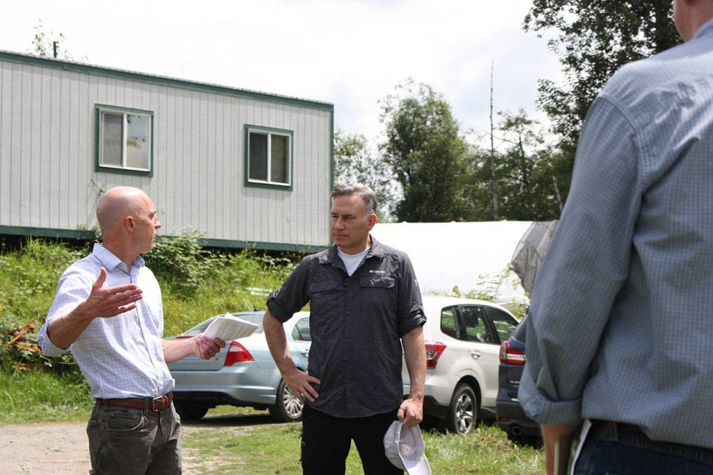 King County executive Dow Constantine, center, toured the new Experience Farming Project plot near carnation in July. Aaron Kunkler/staff photo