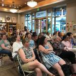 The audience at Brick & Mortar Books in Redmond listens to authors discussing the importance of representation in stories.