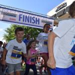 The kids dash lasted just under a mile and was part of the Overlake Labor Day Half at Redmond Town Center. A total of 1,350 runners participated in the half-marathon and 5K races. Top half-marathon finishers were (men) Turner Wiley in 1:05.25 and (women) Lauren Kersjes in 1:15.47. For full online results, visit <a href="https://tinyurl.com/y25kurd4" target="_blank">https://tinyurl.com/y25kurd4</a>. Photo courtesy of Hilary Benson