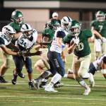 Redmonds Matthew Janetzki powers up field during the Mustangs 34-26 loss to Squalicum at home on Sept. 6. Redmond received touchdowns from Janetzki (20-yard run), Braydon Bruener (65-yard reception), Colby Fazio (39-yard catch) and Carson Bruener (9-yard grab). Quarterback Tyler Fortney was 16-for-30 passing for 278 yards and three touchdowns. On defense, Carson had 8.5 tackles and Braydon had seven tackles. Redmond will next host Seattle Prep at 7 p.m. Sept. 13. Photo courtesy of Matt Campbell Photography