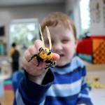 Preston plays with a bee after testing an interactive toy at the 12th annual Goddard School toy test in Redmond.